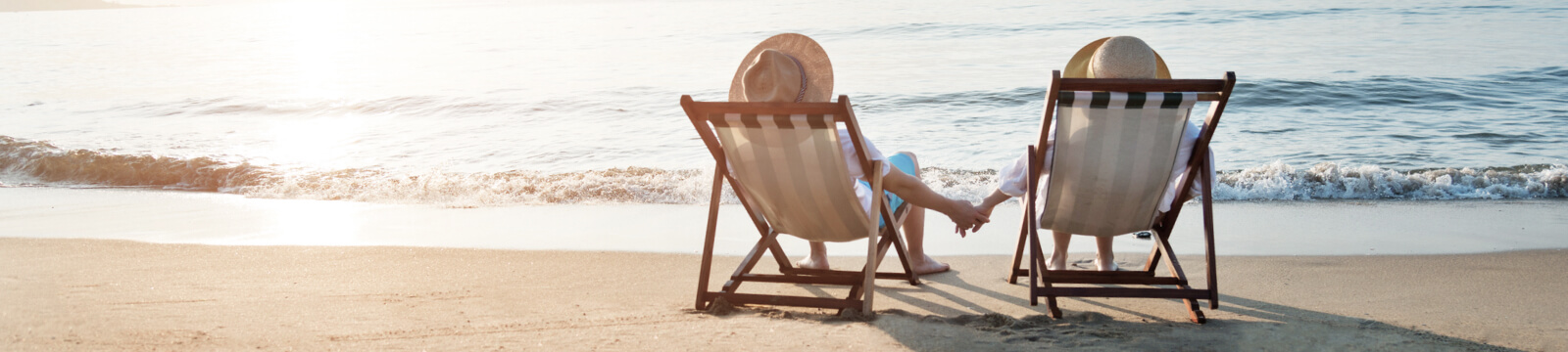 couple in chairs on a beach